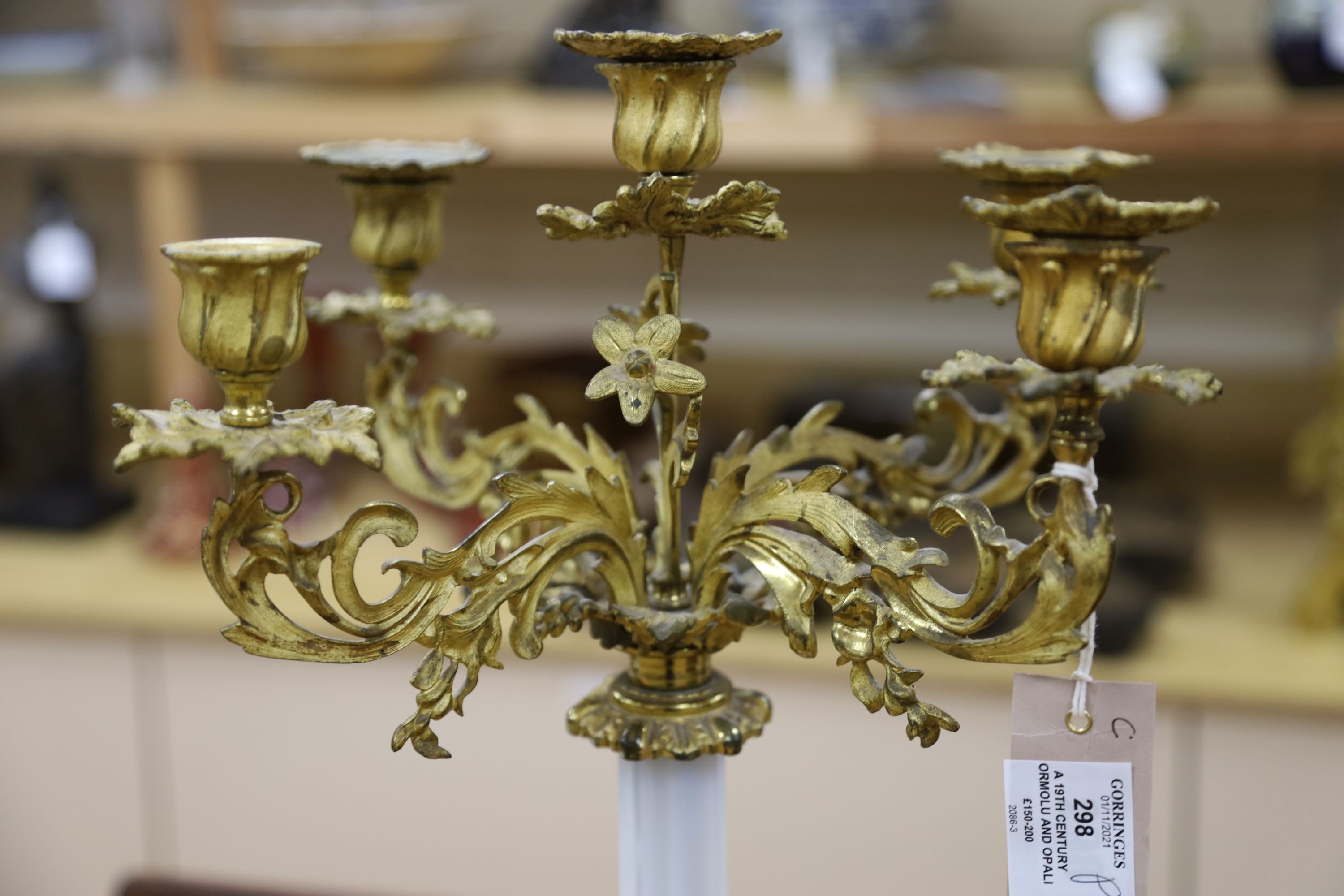 A 19th century ormolu and opaline glass five light candelabrum 63cm